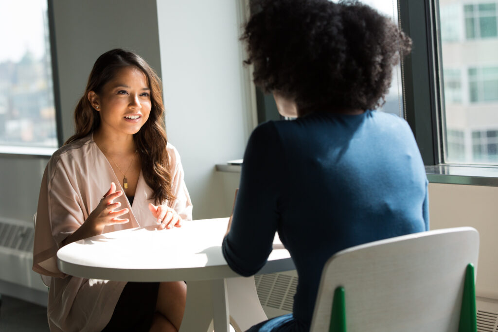 two women talking to each other